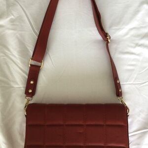 Red cassette style crossbody bag